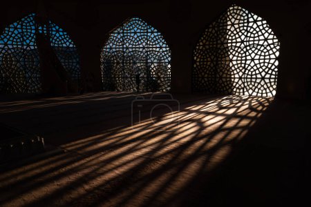 Islamic concept photo. Islamic pattern on the window and shadows on the ground. Ramadan or islamic or laylat al-qadr or kadir gecesi or eid mubarak concept.