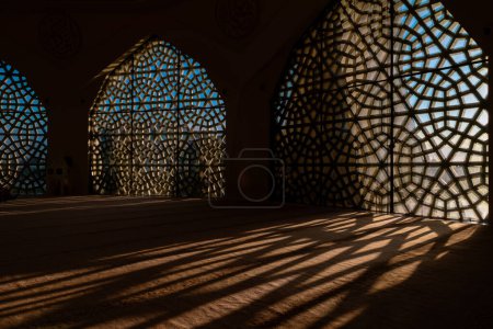 Islamic or ramadan background photo. Shadows of the islamic pattern on the ground.