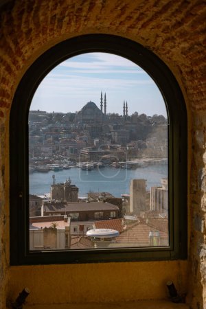 Suleymaniye Mosque and cityscape of Istanbul view from a window of Galata Tower. Travel to Istanbul vertical photo.