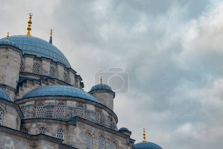 Eminonu New Mosque with cloudy sky on the background. Ramadan or islamic concept photo.