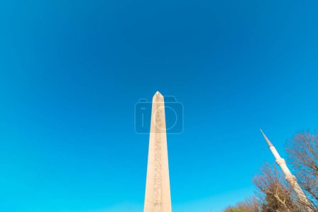 Photo for Obelisk of Theodosius and minaret of Sultanahmet Mosque in Istanbul. Visit Istanbul background photo. - Royalty Free Image