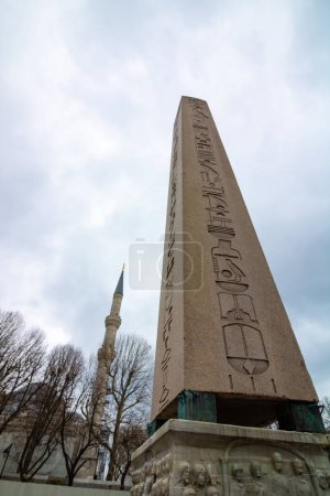 Photo for Obelisk of Theodosius and minaret of Blue Mosque in Sultanahmet Square. Visit Istanbul concept photo. - Royalty Free Image