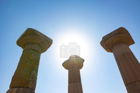 Columns of the Temple of Athena and sun. Ancient city ruins in Turkey background photo.
