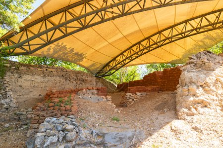 Reconstructed mudbrick walls of Troy ancient city in Canakkale Turkiye. Visit Turkey concept photo.