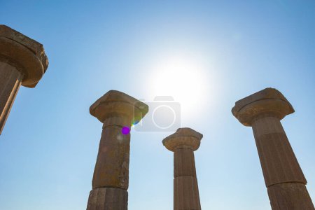 Ancient city ruins concept photo. Columns of the Temple of Athena in Assos ancient city in Canakkale Turkiye.