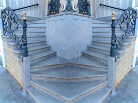 Photo for Abstract mirrored background Concrete stairs with wrought iron railings at San Francisco, California. Side-view of a doorstep with stylish railings and wall mounted handrails - Royalty Free Image