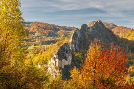 Photo for View of autumn landscape with The Lednica medieval castle in the White Carpathian Mountains, Slovakia, Europe. - Royalty Free Image