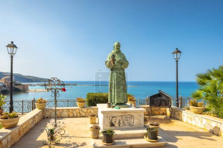 Photo for CASTELLAMMARE DEL GOLFO, ITALY - JULY 13, 2023: Padre Pio statue on the coast. - Royalty Free Image