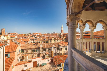 Photo for VENICE, ITALY - MARCH 4, 2023: Historic city centre with St. Mark's Campanile, view from staircase of The Palazzo Contarini del Bovolo. - Royalty Free Image