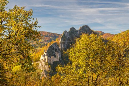Photo for View of autumn landscape with The Lednica medieval castle in the White Carpathian Mountains, Slovakia, Europe. - Royalty Free Image