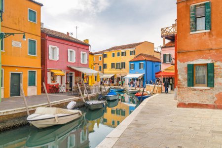 Photo for BURANO, ITALY - MARCH 3, 2023: The island near Venice with a canals between colorful houses. - Royalty Free Image