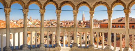 Photo for VENICE, ITALY - MARCH 4, 2023: Historic city centre with St. Mark's Campanile, panoramic view from staircase of The Palazzo Contarini del Bovolo. - Royalty Free Image