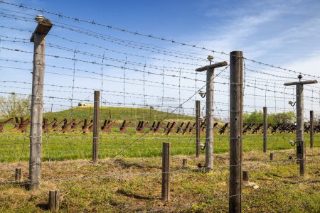 Electric barbed wire fence. Historical Area of the Czechoslovak fortification Satov for defense against Nazi Germany near Znojmo town in the South Moravian Region of the Czech Republic, Europe.