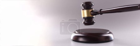 Photo for Close-up of wooden judges gavel on soundboard on grey background. Attorney tool for legal service. Court, law, verdict, legality and justice concept - Royalty Free Image