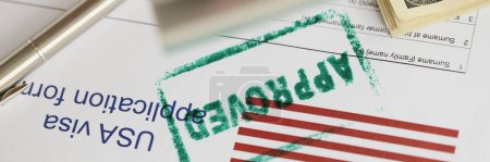 Photo for Close-up of green approved stamp on document, visa application form, hand stamping approved on sheet. Permit, authority, resident, allowed to enter concept - Royalty Free Image