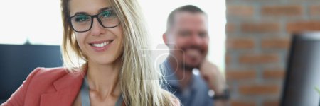 Photo for Portrait of happy businesswoman in glasses at workplace in office. Smiling confident young woman manager - Royalty Free Image