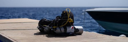 Foto de Oxygen tank with vest and diving accessories set. Diving training in sea concept - Imagen libre de derechos