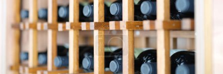 Photo for Homemade wine cellar with wooden boxes for storing bottles. Storage of elite wine concept - Royalty Free Image