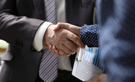 Photo for Close-up of businessman and businesswoman handshaking. Partners signing important and profitable agreement, contract. Business meeting and negotiations concept - Royalty Free Image
