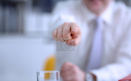 Photo for Male arm point forefinger to you or camera during conference conversation in office closeup. Suggestion illustrate offer proposition bribe demand boss advisor idea concept - Royalty Free Image