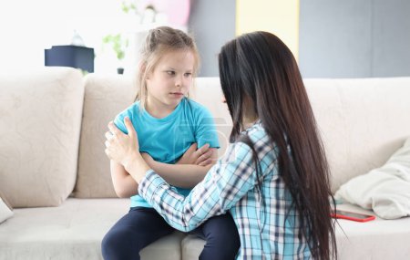 Photo for Llittle offended girl communicates with mother at home. Conflict of children and parents concept - Royalty Free Image