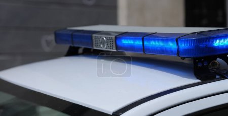 Photo for Police lights on car watching traffic on city road. Flashlight on car of ministry of emergency Situations and red blue flashing lights on cars of special forces concept - Royalty Free Image