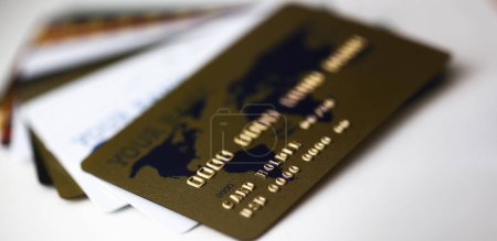 Photo for Many plastic card lie on table white and gold color background - Royalty Free Image