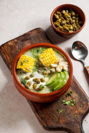 Photo for Traditional Ajiaco Colombiano - Colombian Soup with potato, chicken, avocado, common in Colombia, Cuba and Peru. Latin America - Royalty Free Image