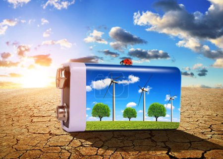 Photo for Battery with wind turbines on the dry cracked soil at sunset. - Royalty Free Image