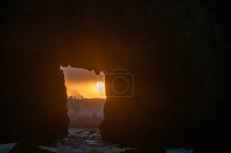 Photo for Detail of the Keyhole arch at Pfeiffer beach, with the setting sun to be just behind it. - Royalty Free Image
