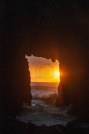 Photo for Detail of the Keyhole arch at Pfeiffer beach, with the setting sun to be just behind it. - Royalty Free Image
