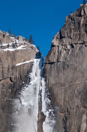 Photo for Exterior of the frozen sides of Yosemite Falls, on a snowy, wintery early January morning. - Royalty Free Image