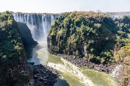 Photo for Victoria Falls, as seen from the Victoria Falls Bridge, connecting Zimbabwe and Zambia - Royalty Free Image