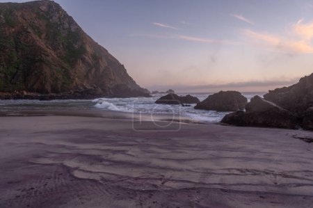 Photo for Sunset at Pfeiffer Beach, near Big Sur, showing the keyhole rock. - Royalty Free Image