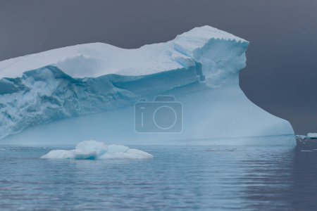 Photo for An Antarctic landscape shot near Cuverville island, highlighting mountains and icebergs. - Royalty Free Image