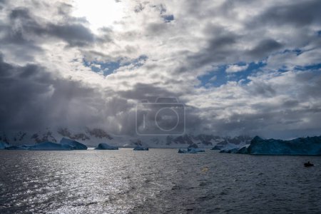 Photo for Giant icebergs along the route between Cuverville island and Portal Point, in the Gerlache Strait. Antarctic Peninsula - Royalty Free Image