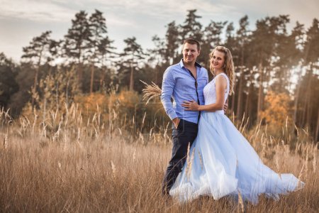 Photo for Happy bride and groom in the green Pine forest - Royalty Free Image