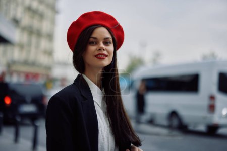 Photo for Woman smile with teeth tourist walks in the city learning the history and culture of the place, stylish fashionable clothes and makeup, spring walk, travel, metropolis. High quality photo - Royalty Free Image