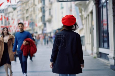 Photo for Woman happiness view from the back, follow me walks walks in the city against the backdrop of office buildings, stylish fashionable vintage clothes and makeup, spring walk, travel. High quality photo - Royalty Free Image
