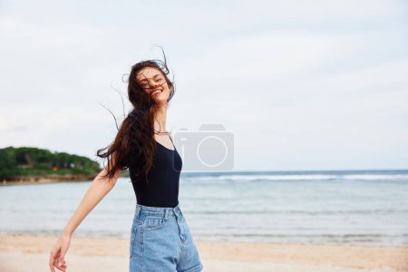 Photo for Sand woman lifestyle relax running body young ocean sexy happy smile positive beauty sunset summer sea happiness fun leisure travel beach - Royalty Free Image