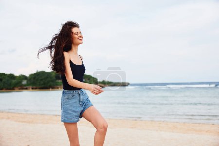 Photo for Woman beach positive activity smiling sea long female sunrise active sunset beautiful lifestyle tan hair running smile vacation young summer person travel - Royalty Free Image