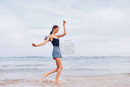 Photo for Girl woman beach beautiful leisure person sunrise smile beauty lifestyle walking summer sunset sea running happy happiness nature young positive travel - Royalty Free Image