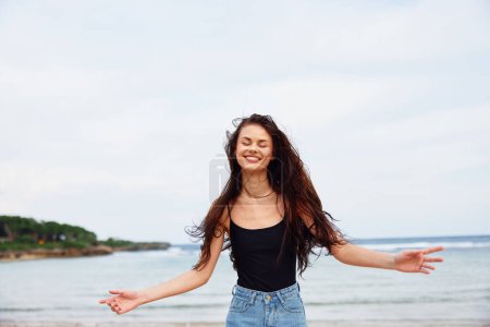 Photo for Woman space sunset summer positive sea carefree female travel sand flight hair long copy body running activity young leisure smile beach lifestyle water - Royalty Free Image