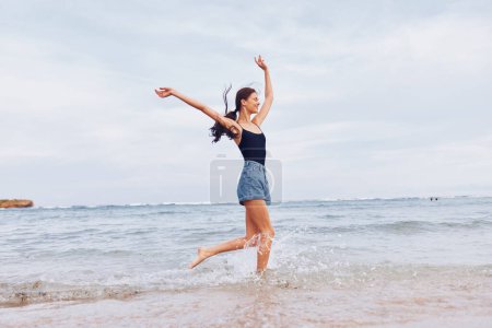 Photo for Beauty woman nature carefree smile ocean beach running walking travel sun leisure hair young fun sunset girl summer sea wave lifestyle - Royalty Free Image