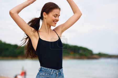 Photo for Female woman smile wave running travel nature copy body tan young smiling sun active beach hair sea summer sunset happy long lifestyle space - Royalty Free Image