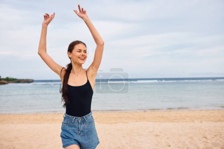Photo for Running woman summer travel lifestyle vacation sunset shore young beautiful smile water freedom copy sea space beach flight walking ocean bikini positive - Royalty Free Image