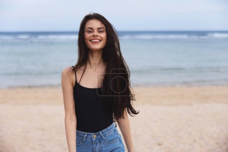 Photo for Person woman running sea relax young happy sand lifestyle beach flight sunset sexy travel summer smile wave leisure beautiful ocean walking - Royalty Free Image