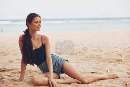 Photo for Woman model sitting freedom travel sand person lifestyle relax young smile tan nature body beach bali summer vacation outdoor pretty sea - Royalty Free Image