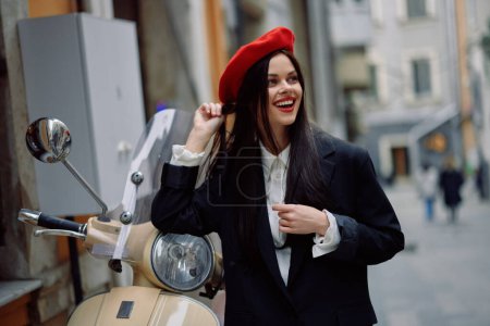 Photo for Beautiful woman smile standing with an old vintage motorcycle on a city street, stylish fashion look of clothes, vacation and travel. High quality photo - Royalty Free Image