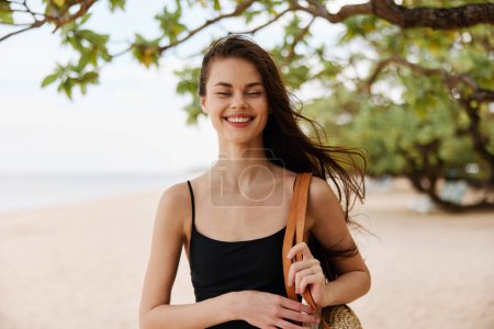Photo for Beach woman coast ocean happy smile relax vacation hair sea walk young long sunlight happiness beautiful running dress nature summer sand free - Royalty Free Image